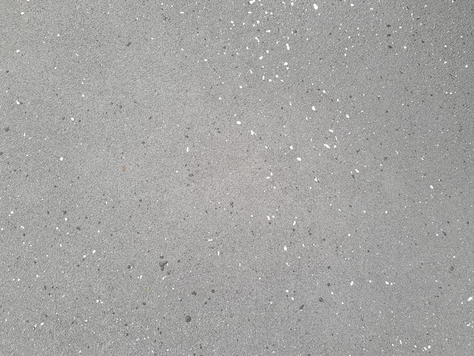Close-up of grey concrete with white flecks
