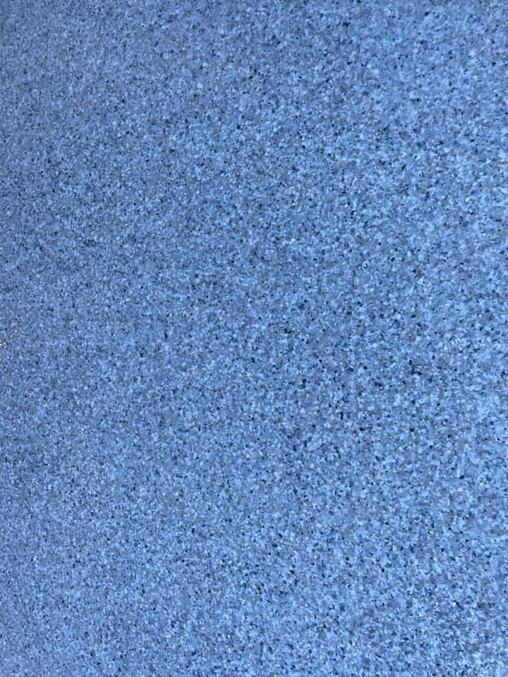 Close-up of a blue-grey flake floor finish