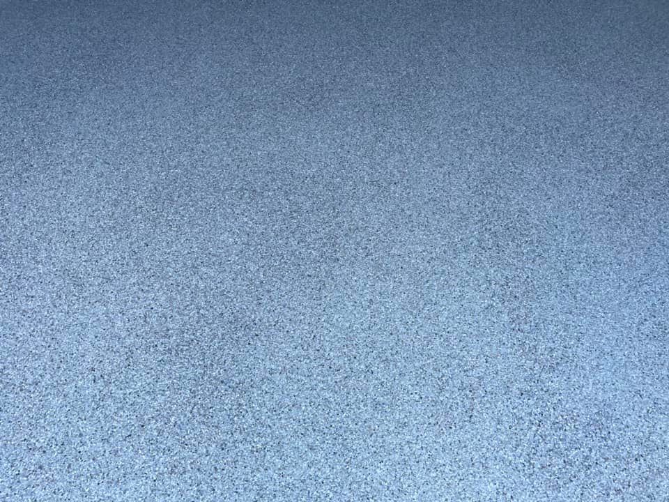 Close-up of a grey flake floor finish