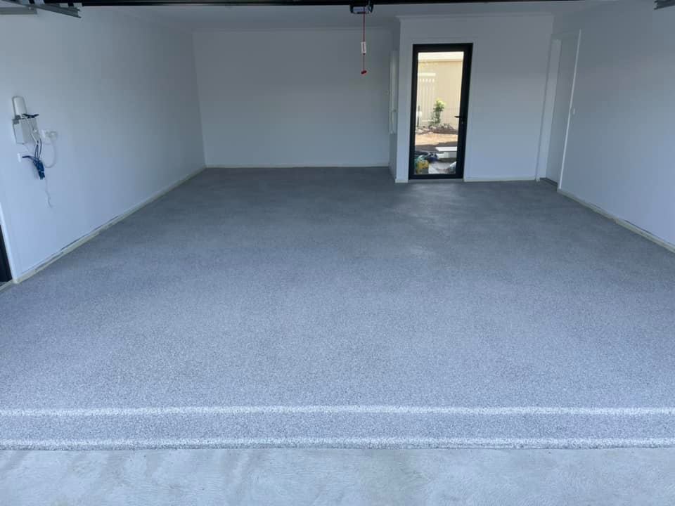 Garage with a new grey flake floor, seen from the driveway