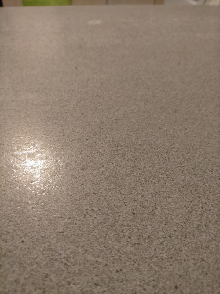 Close-up of a glossy speckled floor coating