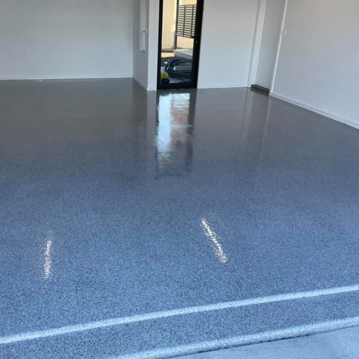 Glossy speckled floor coating in a garage with white walls